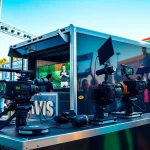 Showcasing mobile production services with a HD production truck at a lively outdoor event.
