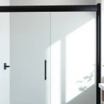 Stylish black shower door black frame featured in a modern bathroom setting, emphasizing elegance and design.