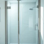 Showcase of a modern shower screen door in a chic bathroom setting.